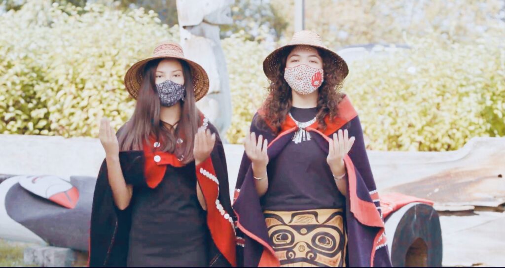 2 women in hats standing outside