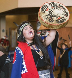 Haida woman dancing