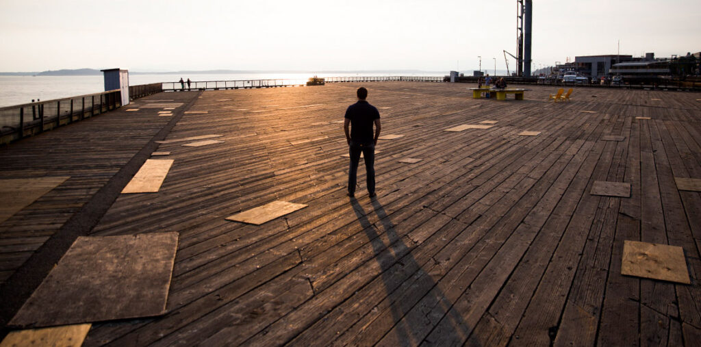 Image of man looking out to the water