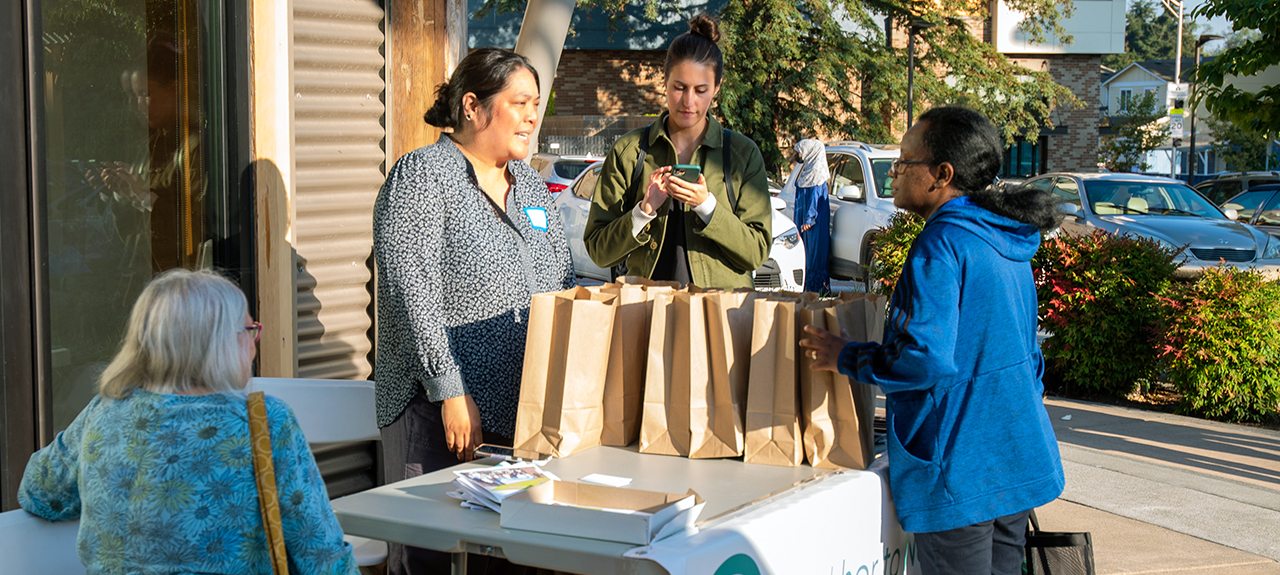 Aileen Balahadia engaged community members at the final Tukwila Village Farmers Market of the season on October 12. | Photo credit: Mel Ponder Photography